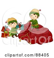 Cute Christmas Elves Loading Presents Into Santas Sack