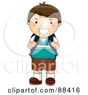 Brunette School Boy Smiling And Holding Onto His Backpack Straps