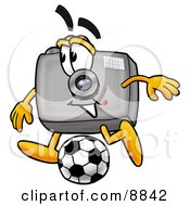 Camera Mascot Cartoon Character Kicking A Soccer Ball