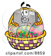 Poster, Art Print Of Camera Mascot Cartoon Character In An Easter Basket Full Of Decorated Easter Eggs