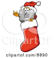 Camera Mascot Cartoon Character Wearing A Santa Hat Inside A Red Christmas Stocking