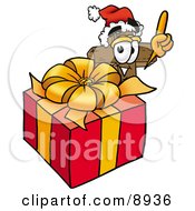 Wooden Cross Mascot Cartoon Character Standing By A Christmas Present