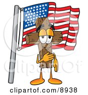 Wooden Cross Mascot Cartoon Character Pledging Allegiance To An American Flag