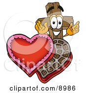 Wooden Cross Mascot Cartoon Character With An Open Box Of Valentines Day Chocolate Candies