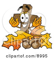 Wooden Cross Mascot Cartoon Character With Autumn Leaves And Acorns In The Fall