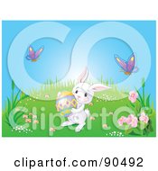 Poster, Art Print Of Cute White Bunny Carrying An Easter Egg On A Spring Hill