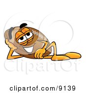 Clipart Picture Of A Football Mascot Cartoon Character Resting His Head On His Hand