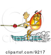 Flame Mascot Cartoon Character Waving While Water Skiing