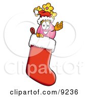 Vase Of Flowers Mascot Cartoon Character Wearing A Santa Hat Inside A Red Christmas Stocking
