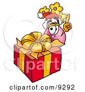 Vase Of Flowers Mascot Cartoon Character Standing By A Christmas Present