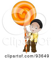 Little Boy Holding Up A Giant Orange Sucker