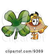Hard Hat Mascot Cartoon Character With A Green Four Leaf Clover On St Paddys Or St Patricks Day by Mascot Junction