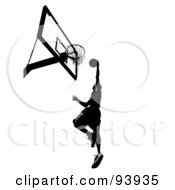 Poster, Art Print Of Black Silhouetted Man Leaping Towards A Basketball Hoop