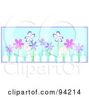 Poster, Art Print Of Row Of Pink And Purple Spring Flowers Behind A Picket Fence Over Blue With Purple Trim
