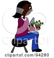 Poster, Art Print Of Pleasant African American Woman Sitting On A Stool And Gardening