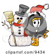 Hockey Puck Mascot Cartoon Character With A Snowman On Christmas