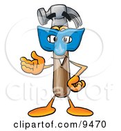 Hammer Mascot Cartoon Character Wearing A Blue Mask Over His Face