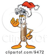 Clipart Picture Of A Hammer Mascot Cartoon Character Wearing A Santa Hat And Waving