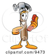 Clipart Picture Of A Hammer Mascot Cartoon Character Holding A Telephone