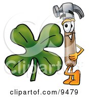 Hammer Mascot Cartoon Character With A Green Four Leaf Clover On St Paddys Or St Patricks Day by Mascot Junction