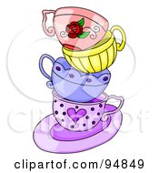 Messy Stack Of Colorful Tea Cups On A Purple Saucer