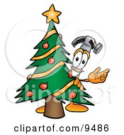 Poster, Art Print Of Hammer Mascot Cartoon Character Waving And Standing By A Decorated Christmas Tree