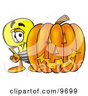 Clipart Picture Of A Light Bulb Mascot Cartoon Character With A Carved Halloween Pumpkin