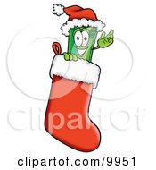 Rolled Money Mascot Cartoon Character Wearing A Santa Hat Inside A Red Christmas Stocking