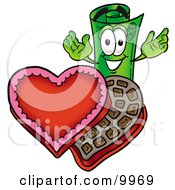 Rolled Money Mascot Cartoon Character With An Open Box Of Valentines Day Chocolate Candies